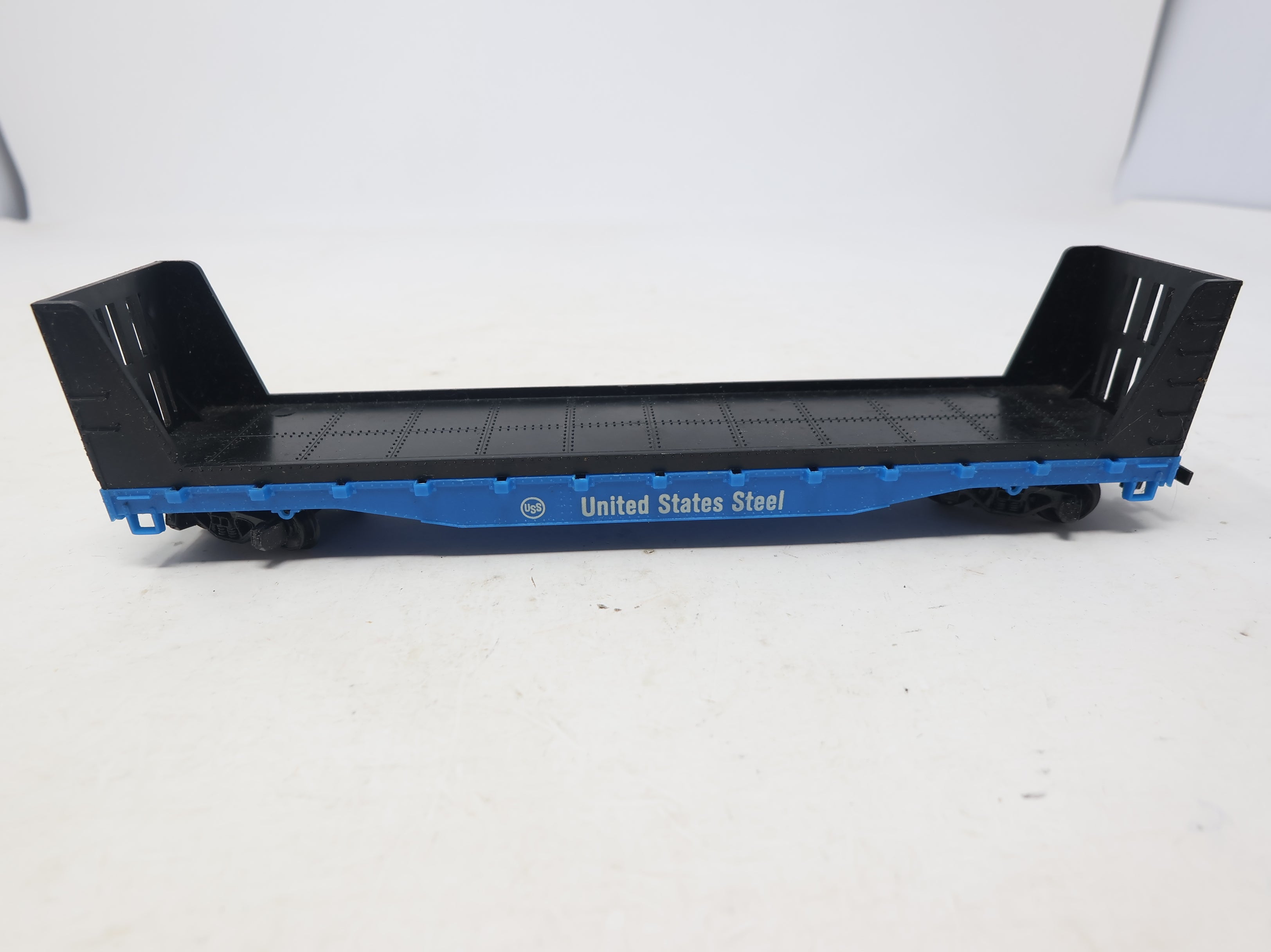 USED Tyco HO Scale 50' Bulkhead Flat Car United States Steel Blue