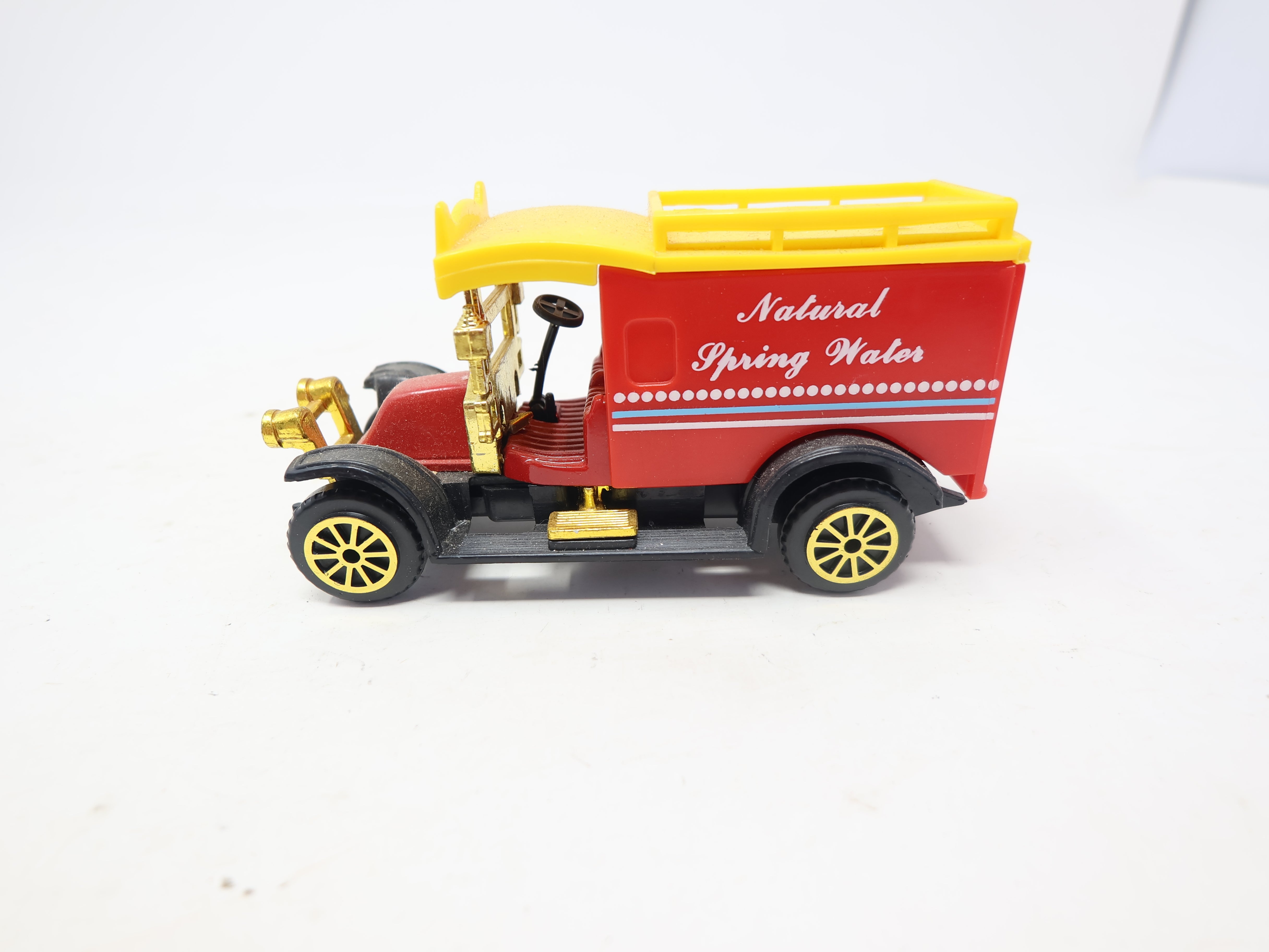 USED , Collectors Natural Spring Waters Red/Yellow Truck